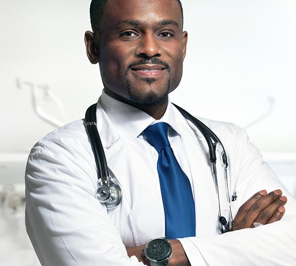 a man wearing white coat