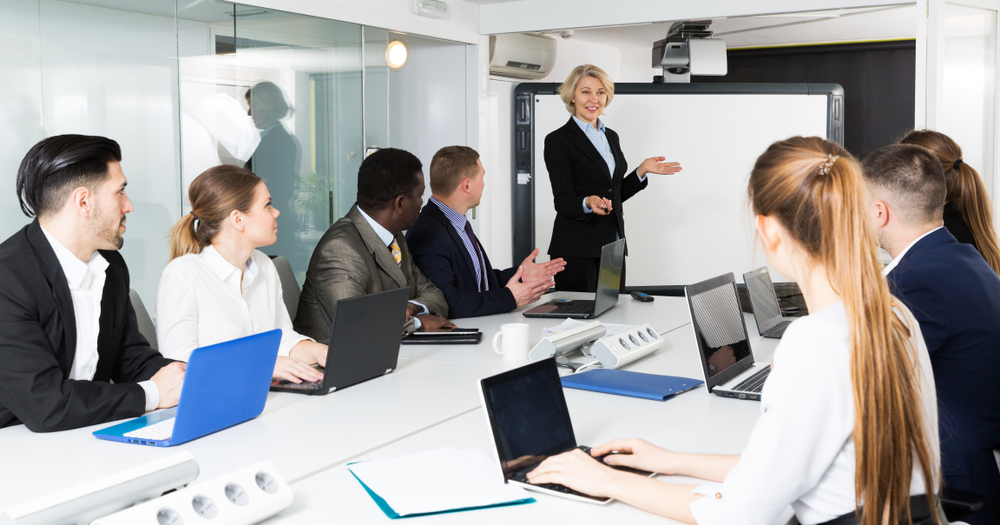 Employees discussing in a medical transcription company